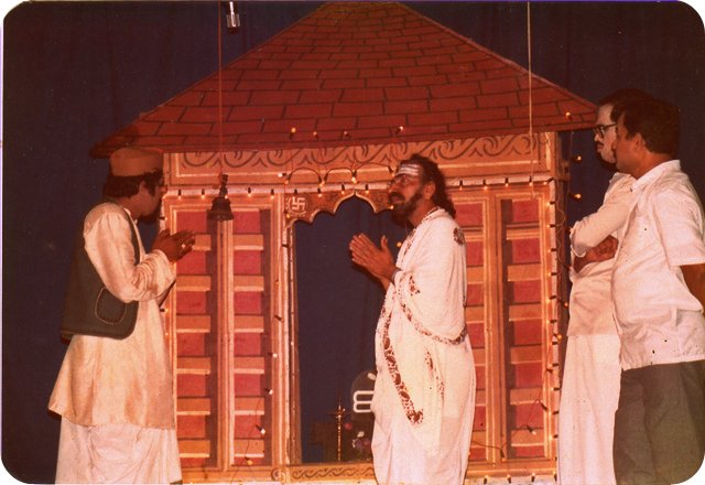 Puninchathaya acting as a priest in the play 'Devaru Doddavanu'.